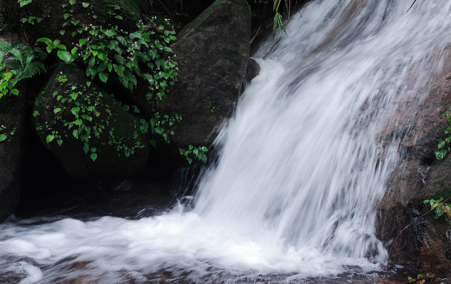 Natural waterfall through scenic trails